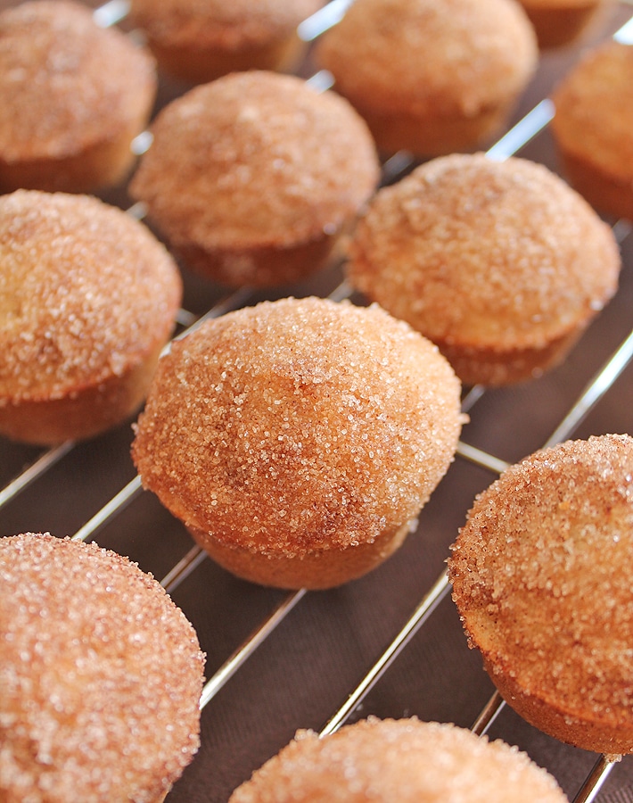 Old Fashioned Cake Doughnut Mini Muffins on a stainless steel metal cooling rack.