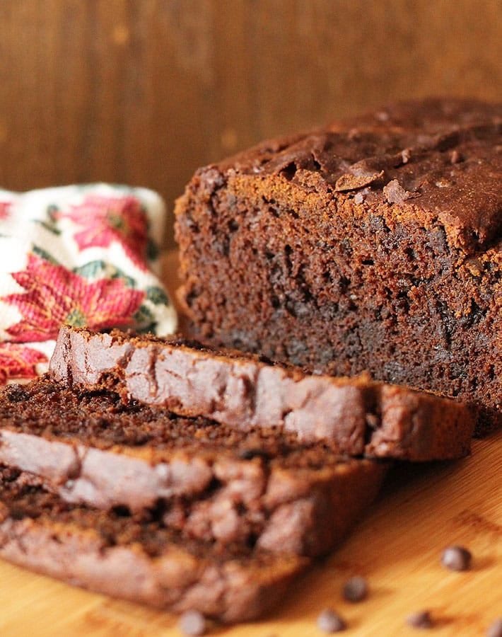 A sliced Vegan Gluten Free Gingerbread Loaf on a cutting board.