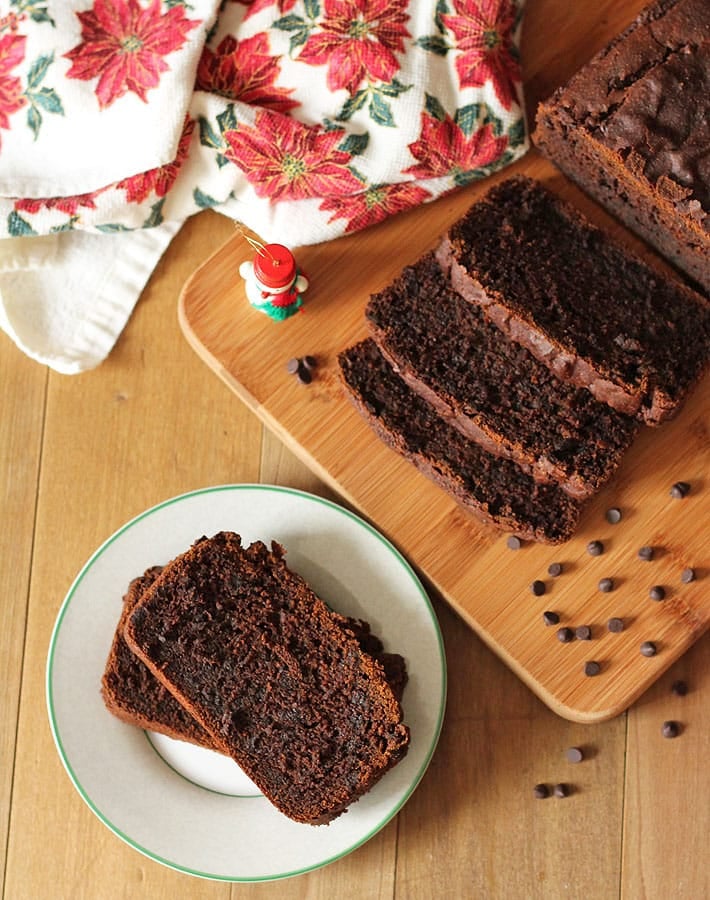 Slices of Vegan Gluten Free Gingerbread Loaf on a brown table.