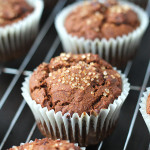 Vegan Gluten Free Gingerbread Chocolate Chip Muffins sitting on a stainless steel cooling rack.