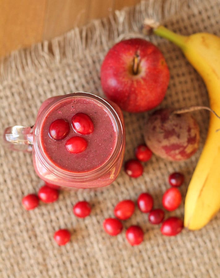 Overhead shot of a Cranberry Apple Smoothie in a glass mug.
