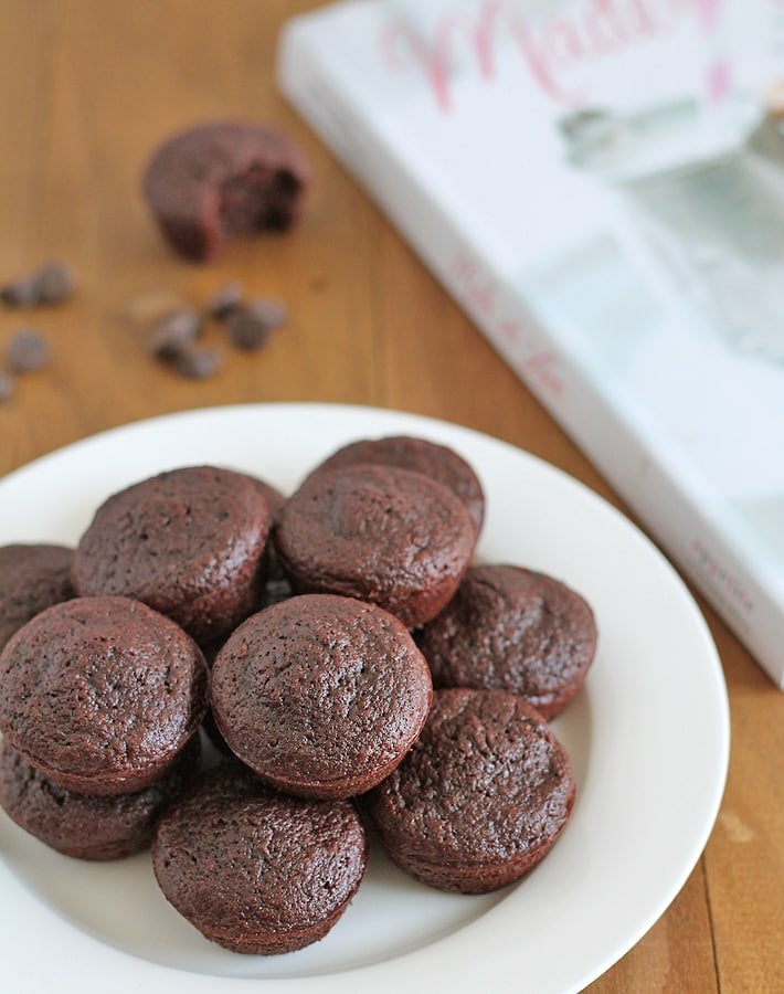 A stack of Dairy Free Gluten Free Brownies on a white plate.