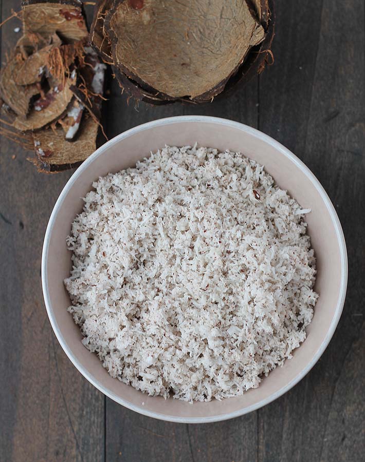 A bowl full of grated fresh coconut.