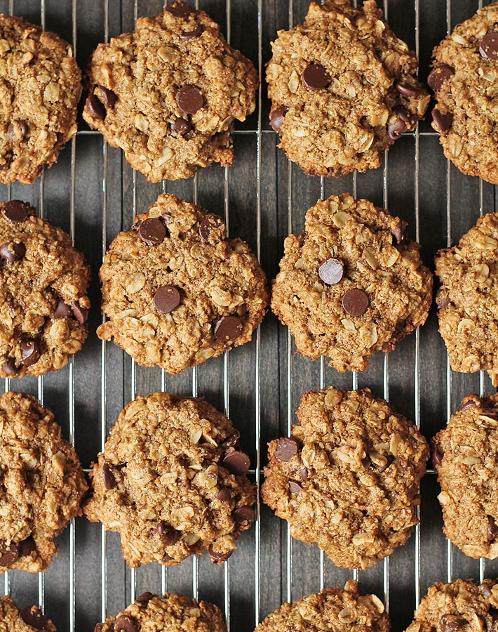 A cooling rack filled with vegan oatmeal coconut cookies.