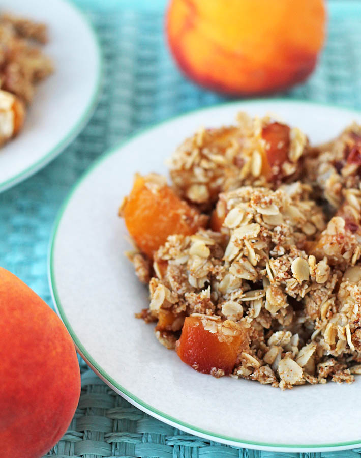 This gluten free Vegan Peach Ginger Crisp makes great use of sweet summer peaches. An easy, delicious, and not overly-sweet dessert to serve to guests!