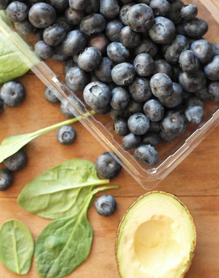 Overhead shot of the ingredients needed to make a Blueberry Pineapple Smoothie.