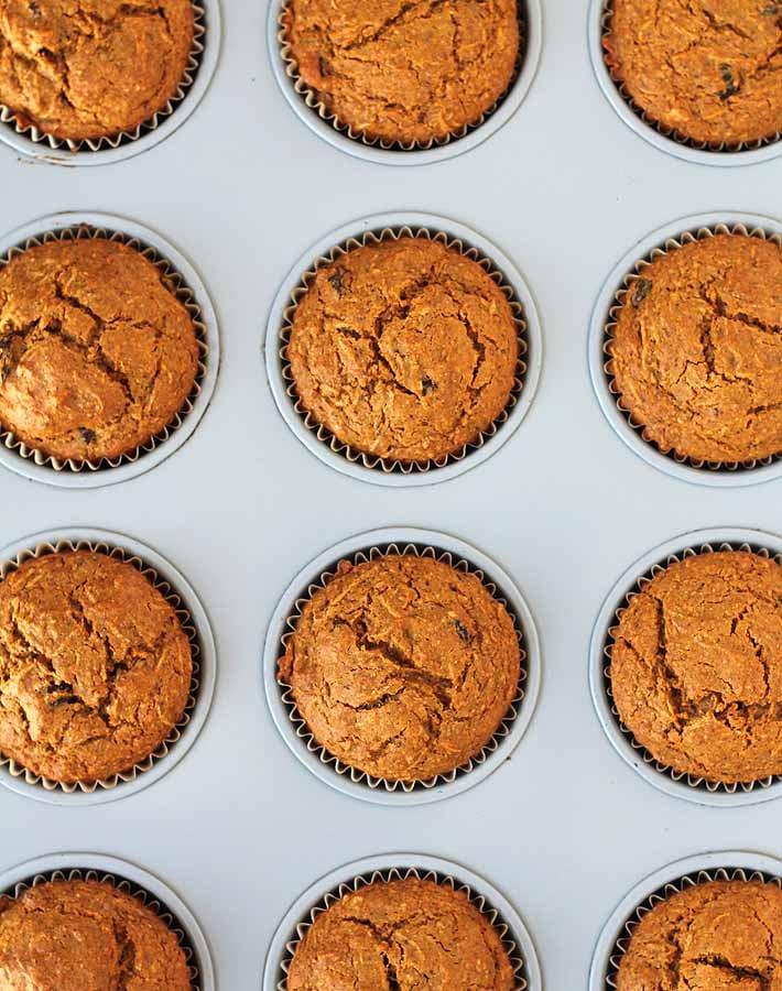 Overhead shot of Carrot Ginger Muffins in a muffin tin.