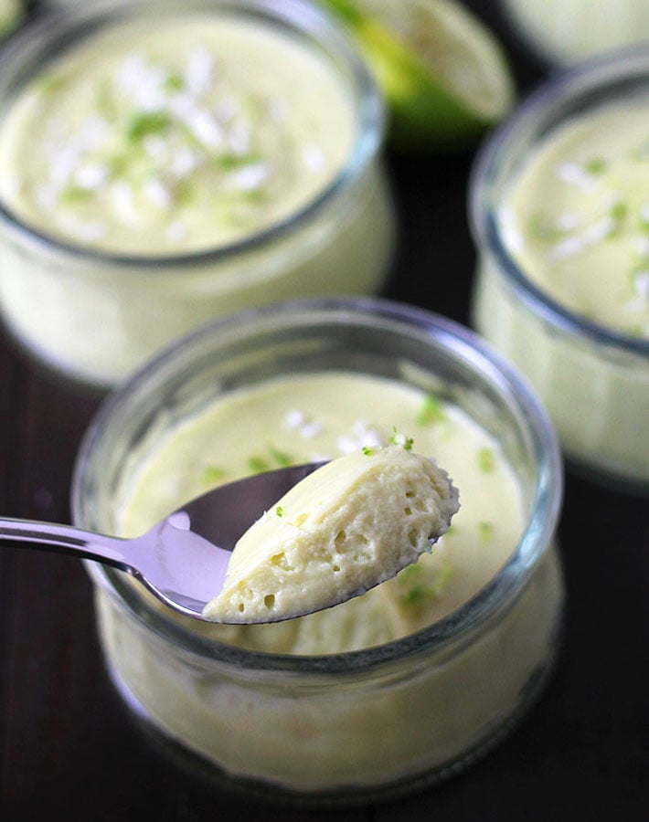 A close up shot of vegan Key Lime Cups on a dessert spoon.