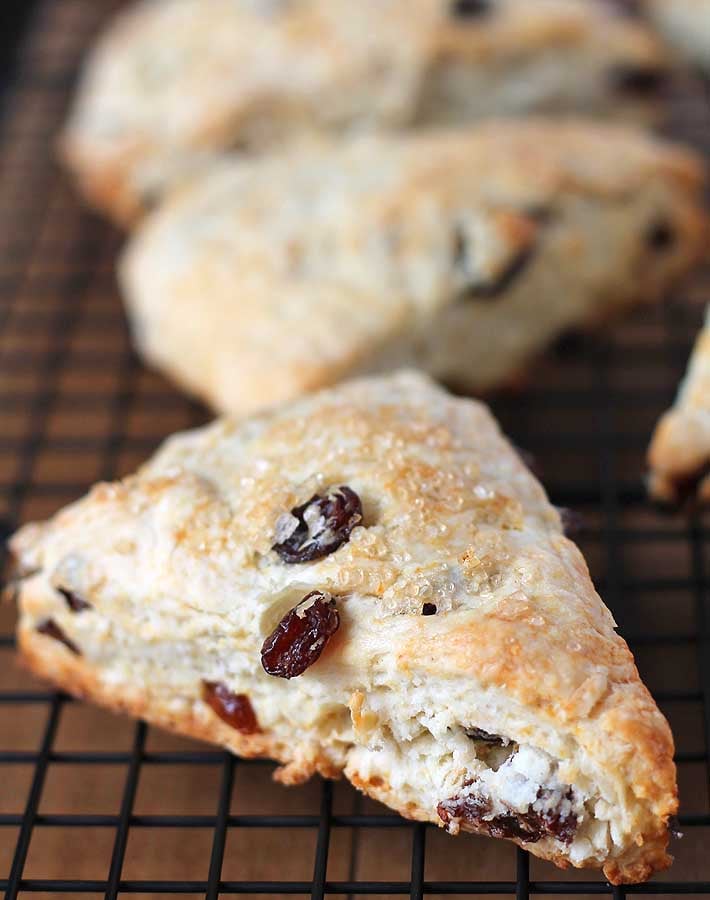 Up close shot of Coconut Raisin Vegan Scones showing the outer texture with turbinado sugar sprinkled on the top.