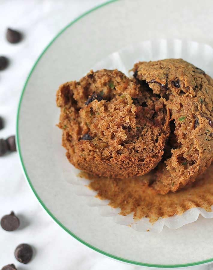 Vegan Gluten Free Zucchini Chocolate Chip Muffins split apart showing inside texture.