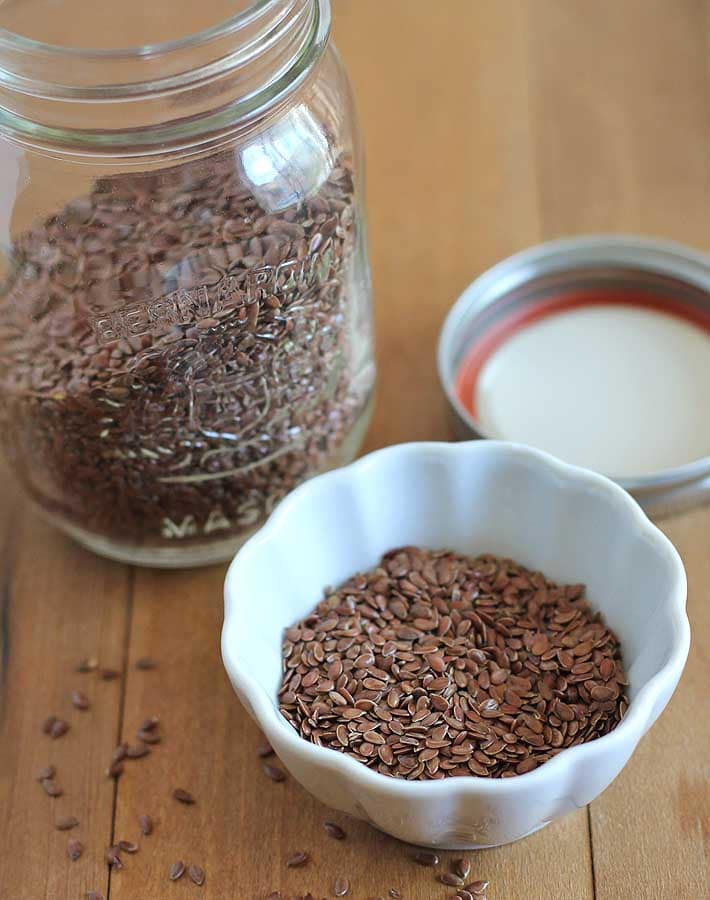 Whole flax seeds in a bowl to show how to make a flax egg.