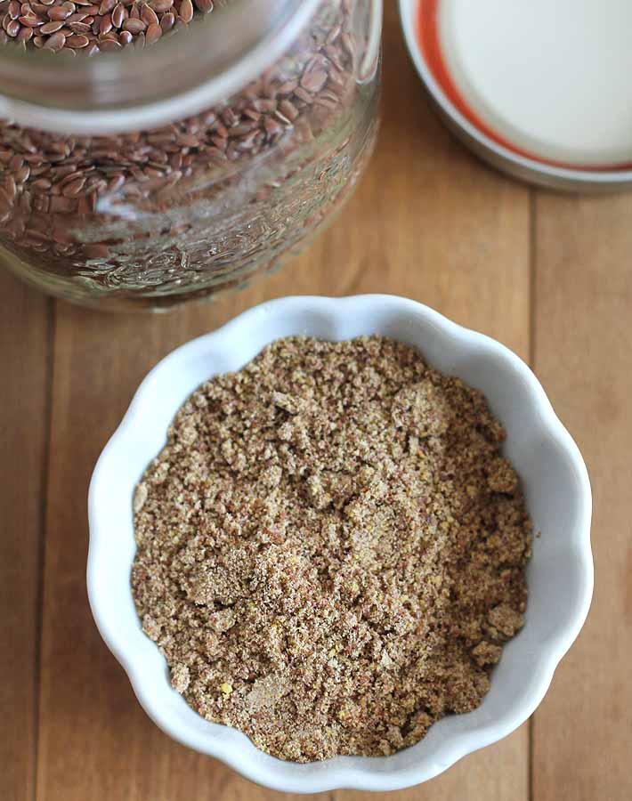 A small container holding ground flax seeds needed to show how to make a flax egg.