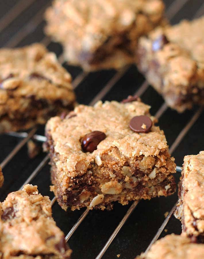 Chocolate Chip Peanut Butter Oatmeal Bars sitting on a metal cooling rack.