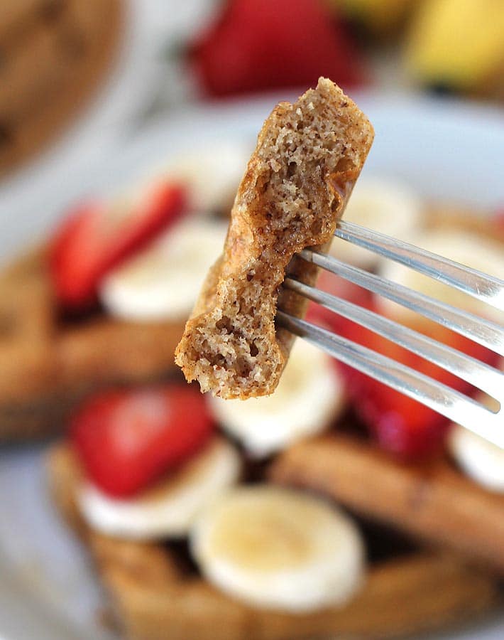 Close up shot of the inside of gluten-free Vegan Banana Waffles, inside shows that the waffle is fluffy on the inside.