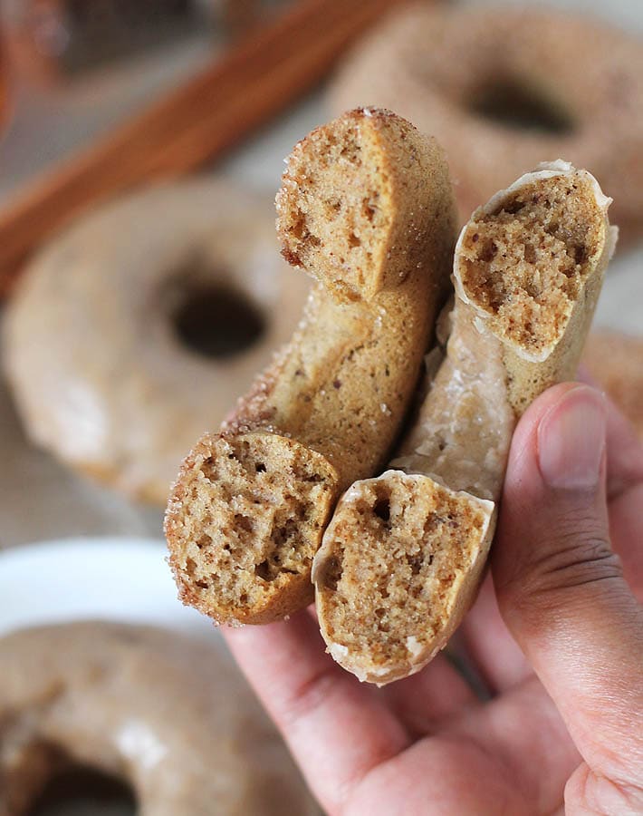 Inside shot of two Chai-Spiced Baked Vegan Doughnuts to show how fluffy they are.