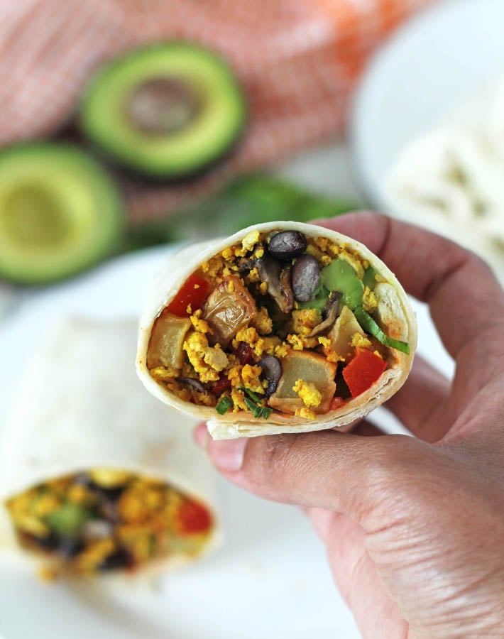 a close up of a Tofu Breakfast Burrito showing the inside.