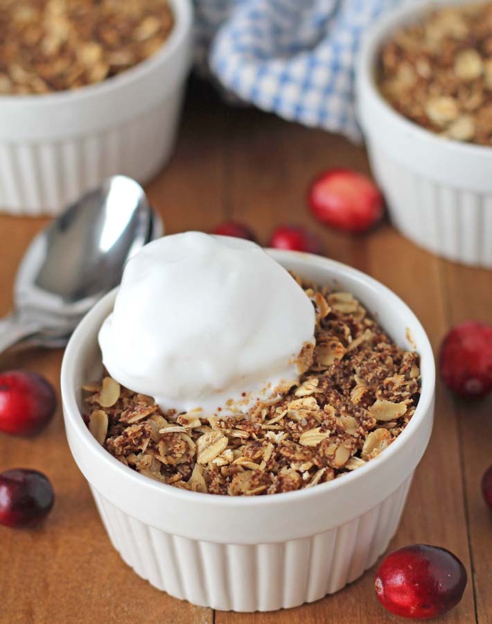 Pear Cranberry Crisp with a dollop of vanilla ice cream on top.