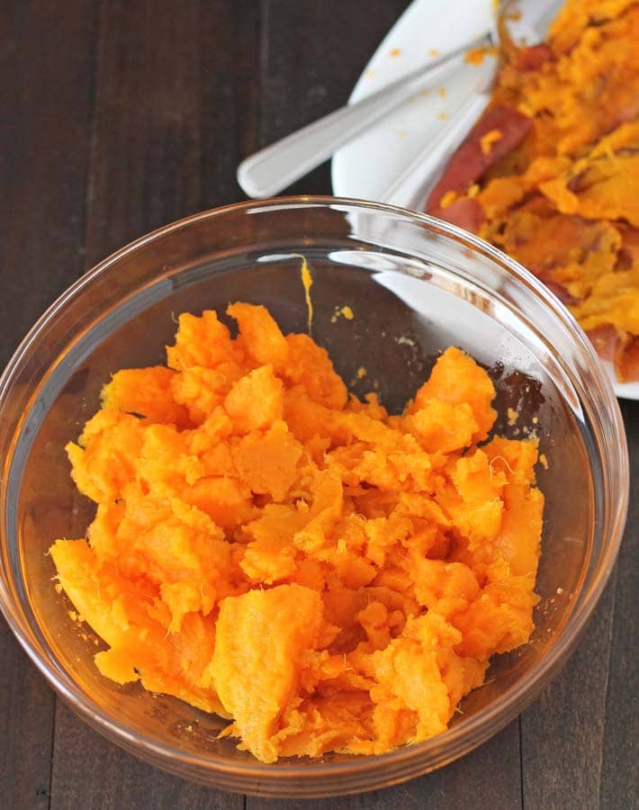 Mashed Instant Pot Sweet Potatoes in a glass bowl.