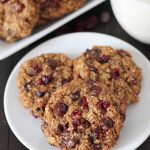 Close up shot of Oatmeal Cranberry Chocolate Chip Cookies on a plate.
