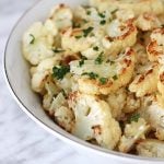 Close up shot of a bowl of Roasted Garlic Cauliflower.