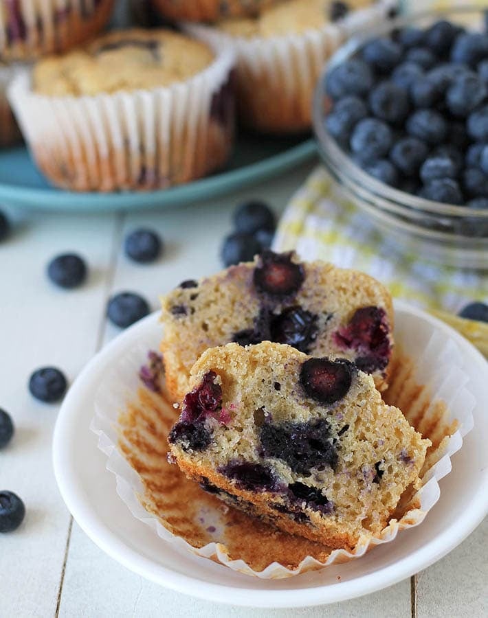 A blueberry muffin split in half to show the inner texture.