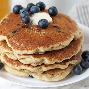 A stack of Gluten-Free Blueberry Pancakes on a plate.