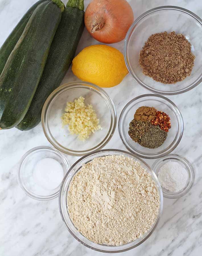 Overhead shot of the ingredients needed to make vegan zucchini fritters.