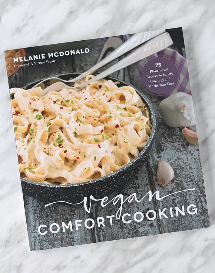 The book "Vegan Comfort Cooking" on a table.