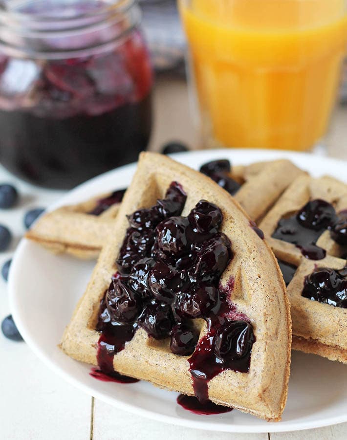 Waffles topped with fresh blueberry compote.