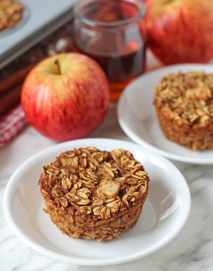 A vegan baked oatmeal cup on a small white plate.