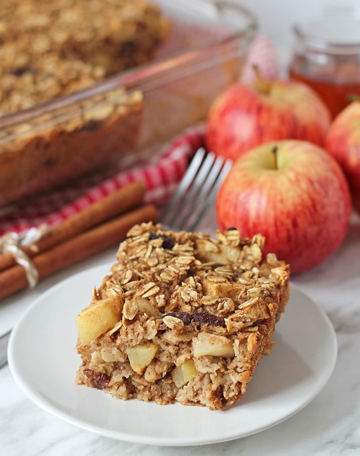 A square of apple baked vegan oatmeal on a plate.