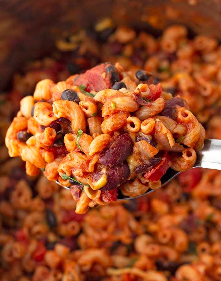 A spoon full of vegan chili macaroni.