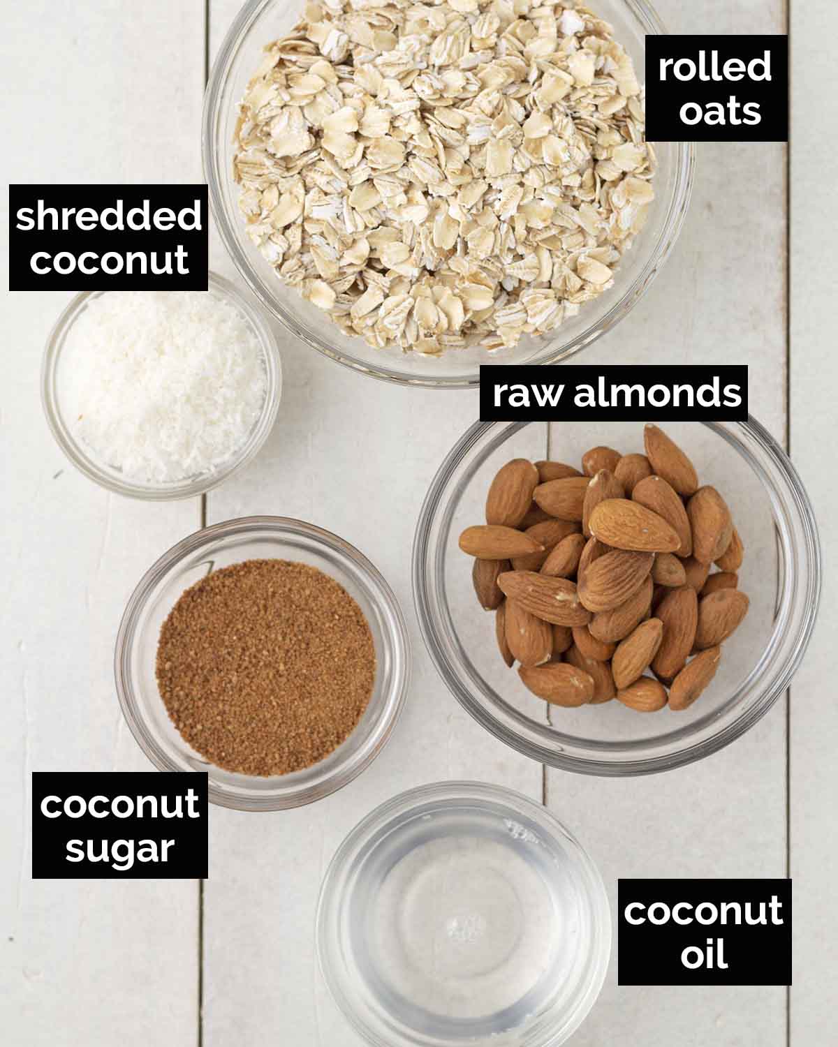 An overhead shot showing the ingredients needed to make lemon cheesecake bites, each ingredient is labelled with text.