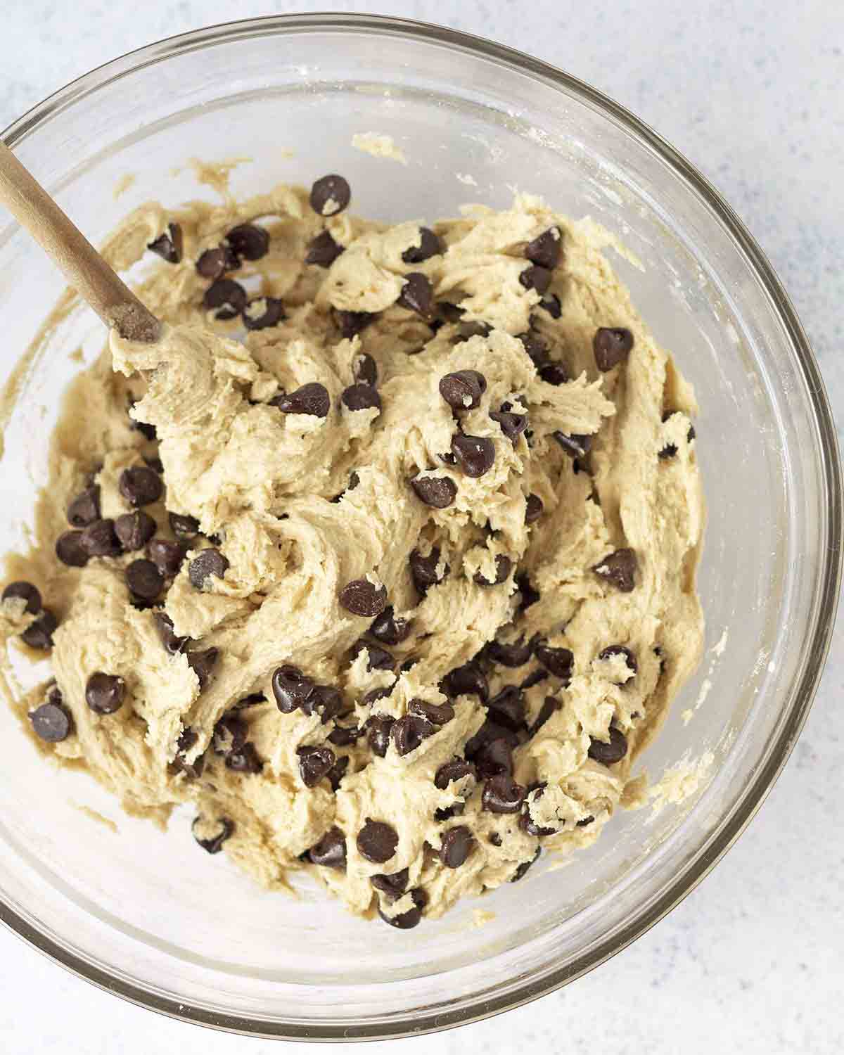An overhead shot showing a bowl of eggless chocolate chip cookie dough.