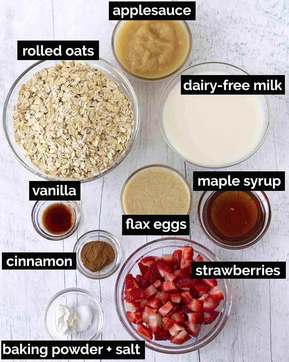 An overhead shot showing all the ingredients needed to make baked oatmeal with strawberries.
