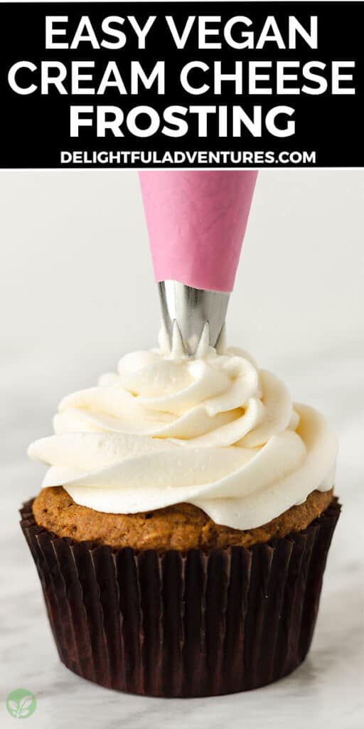Pinterest pin showing a cupcake being piped with cream cheese frosting, image is to be used to pin this recipe to Pinterest.