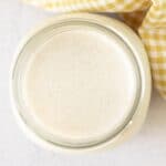 An overhead shot showing a jar of homemade vegan buttermilk.