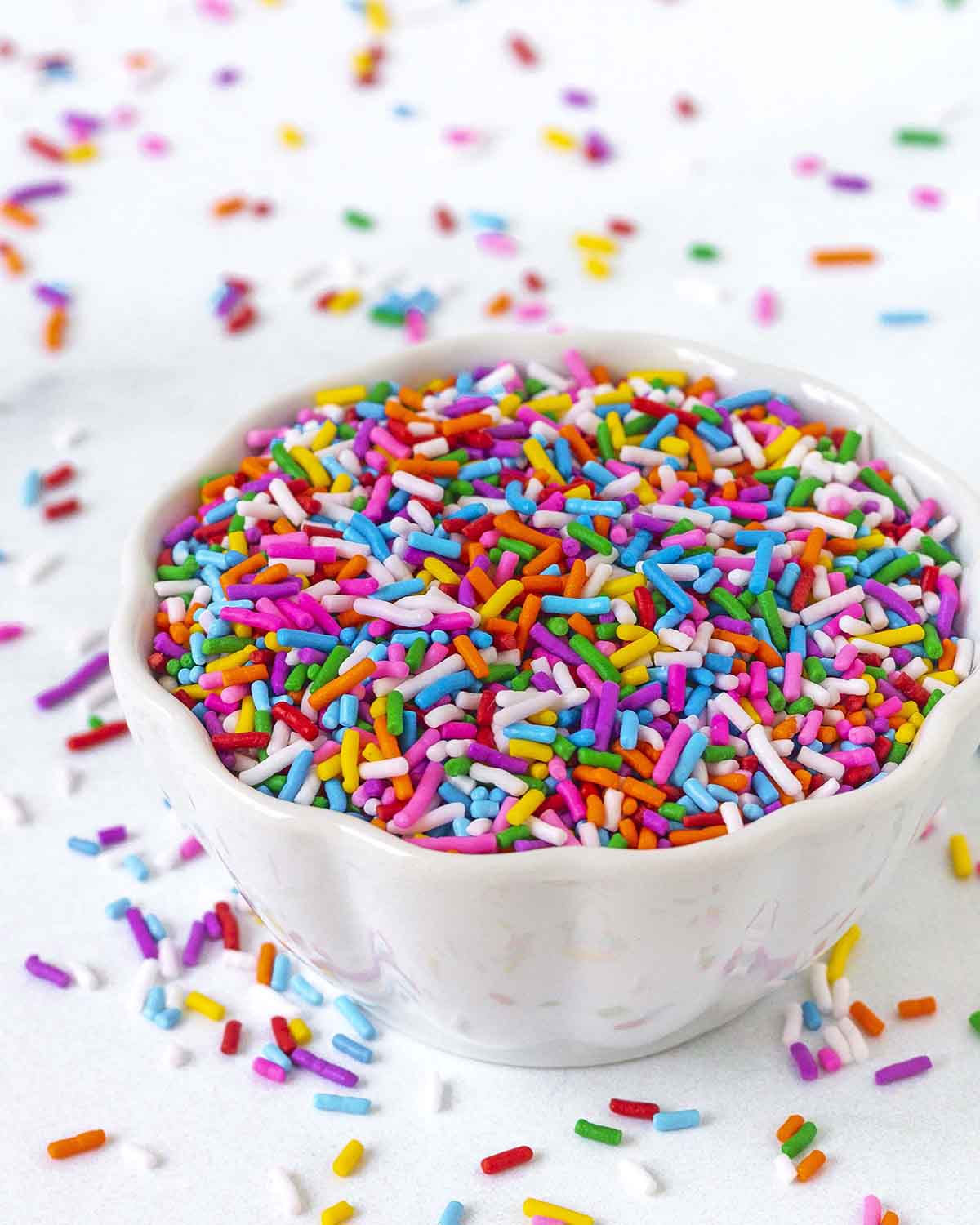 A bowl filled with dairy-free rainbow sprinkles.