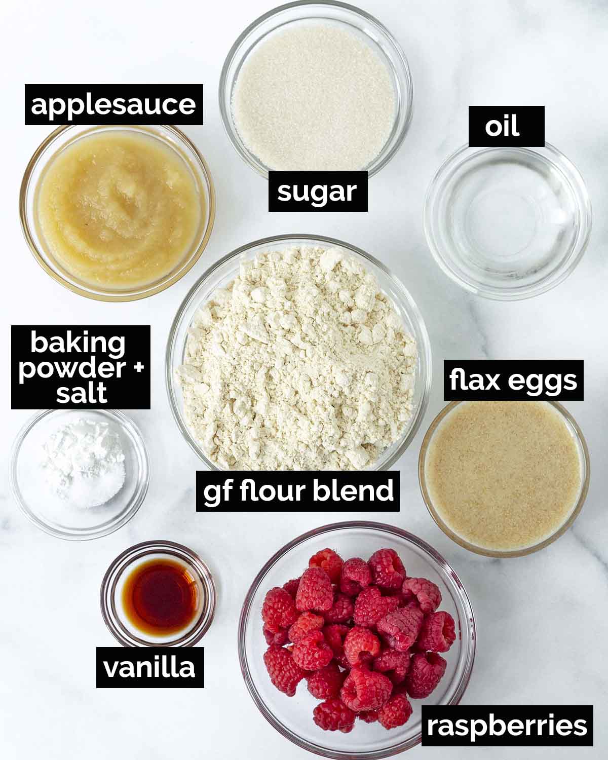 An overhead shot showing the ingredients needed to make vegan vegan gluten-free raspberry muffins.