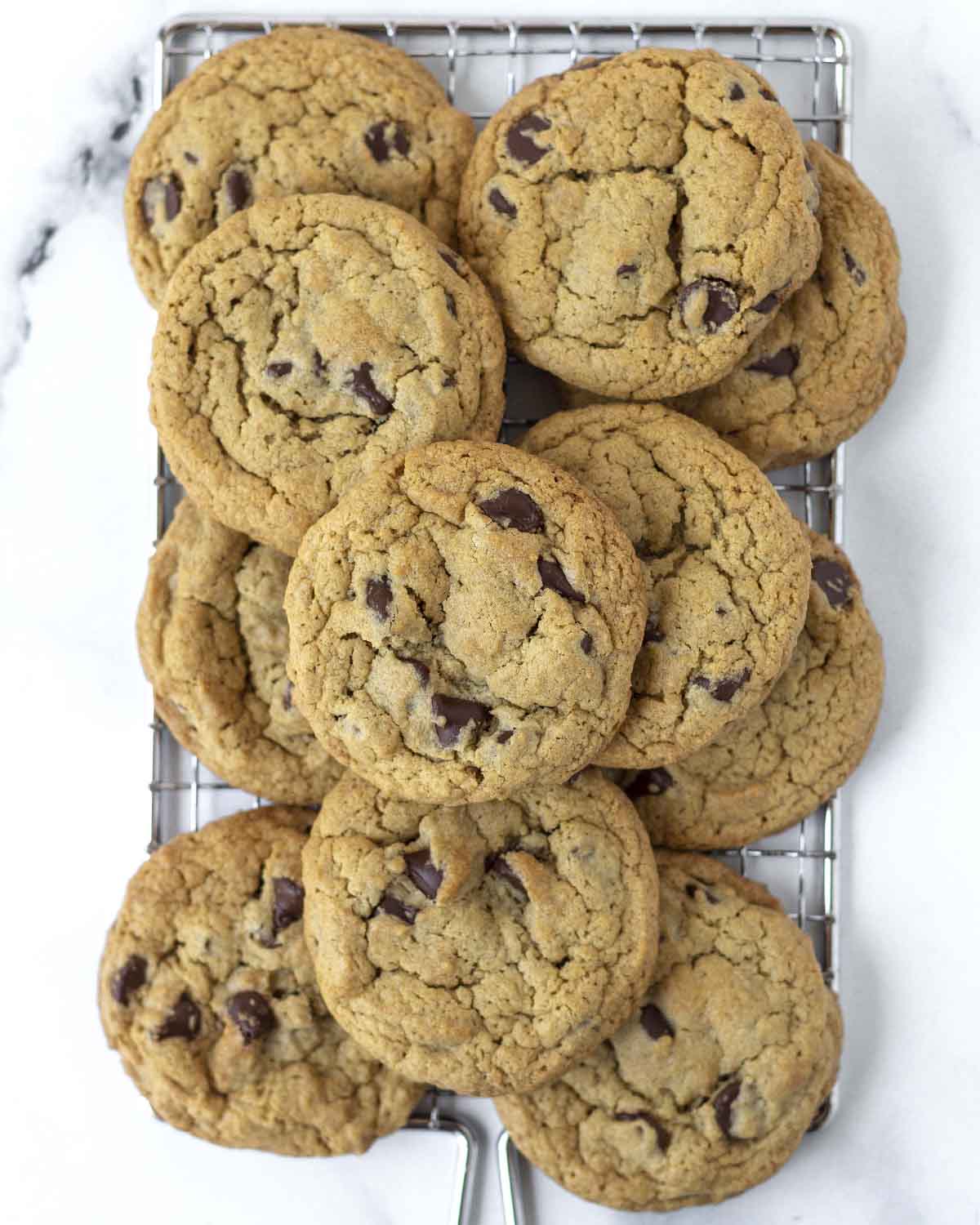 An overhead shot of vegan gluten-free oat flour cookies on a cooling rack.