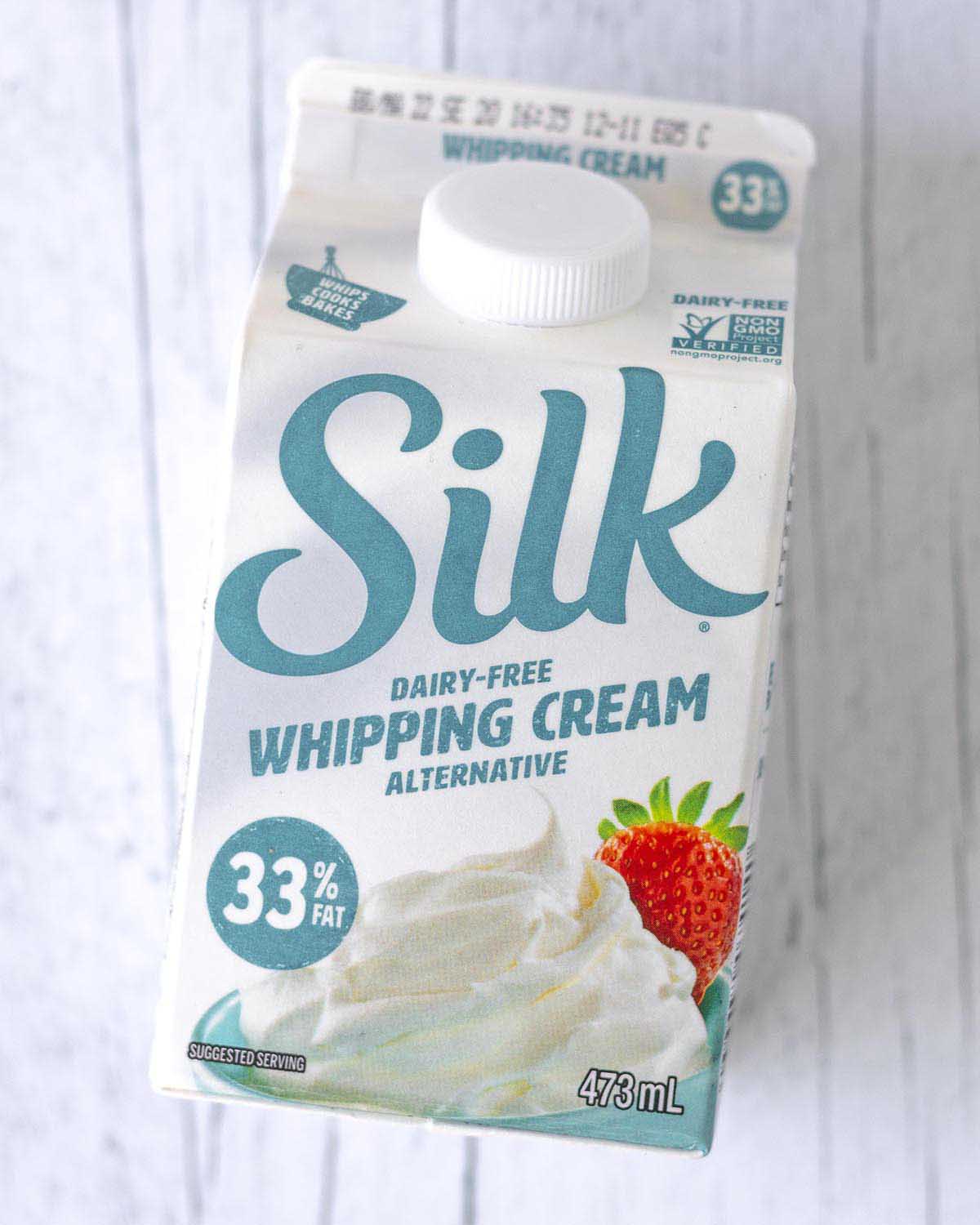 An overhead shot showing a small carton of Silk brand dairy-free whipping cream alternative.