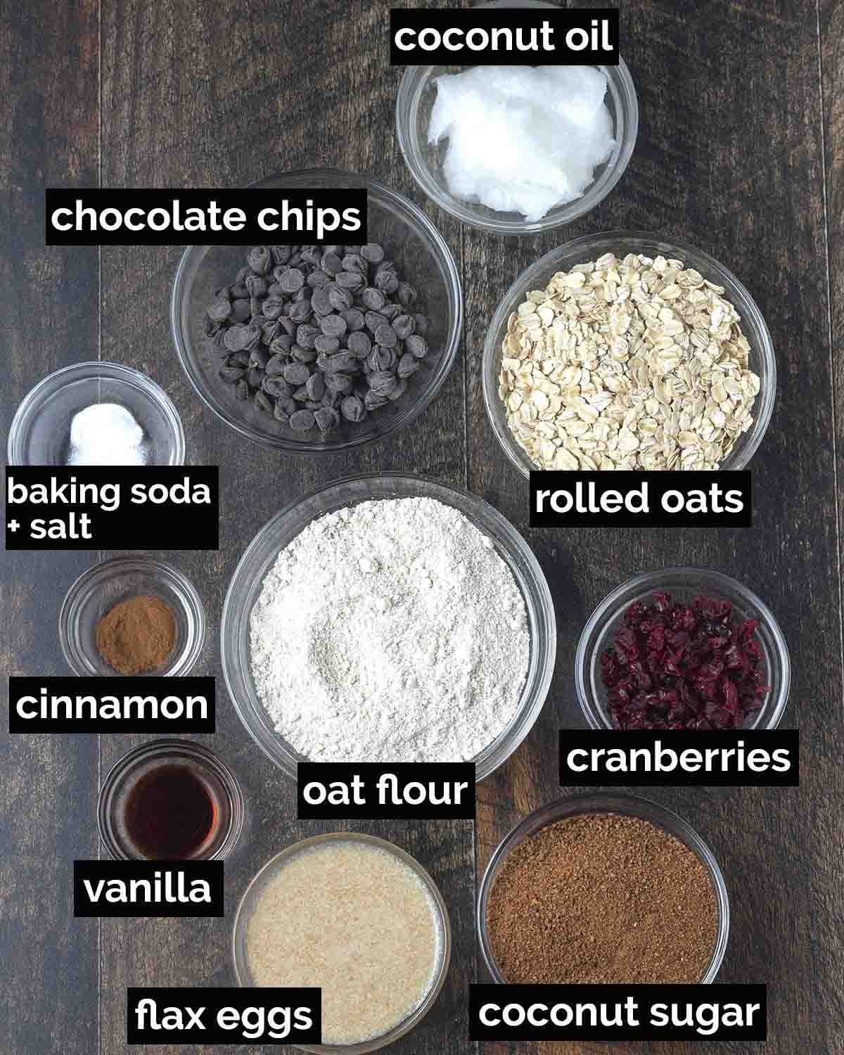 An overhead shot showing the ingredients needed to make vegan oatmeal cranberry cookies.