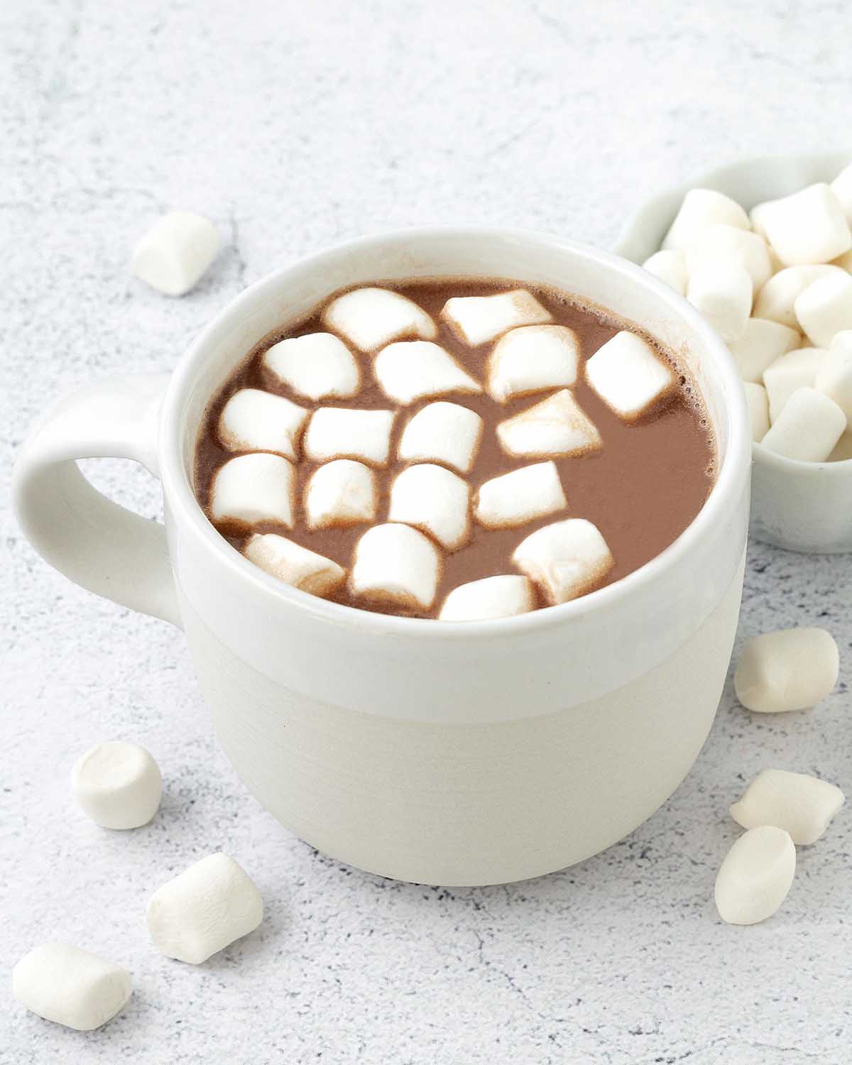 A mug of vegan hot chocolate with mini marshmallows.