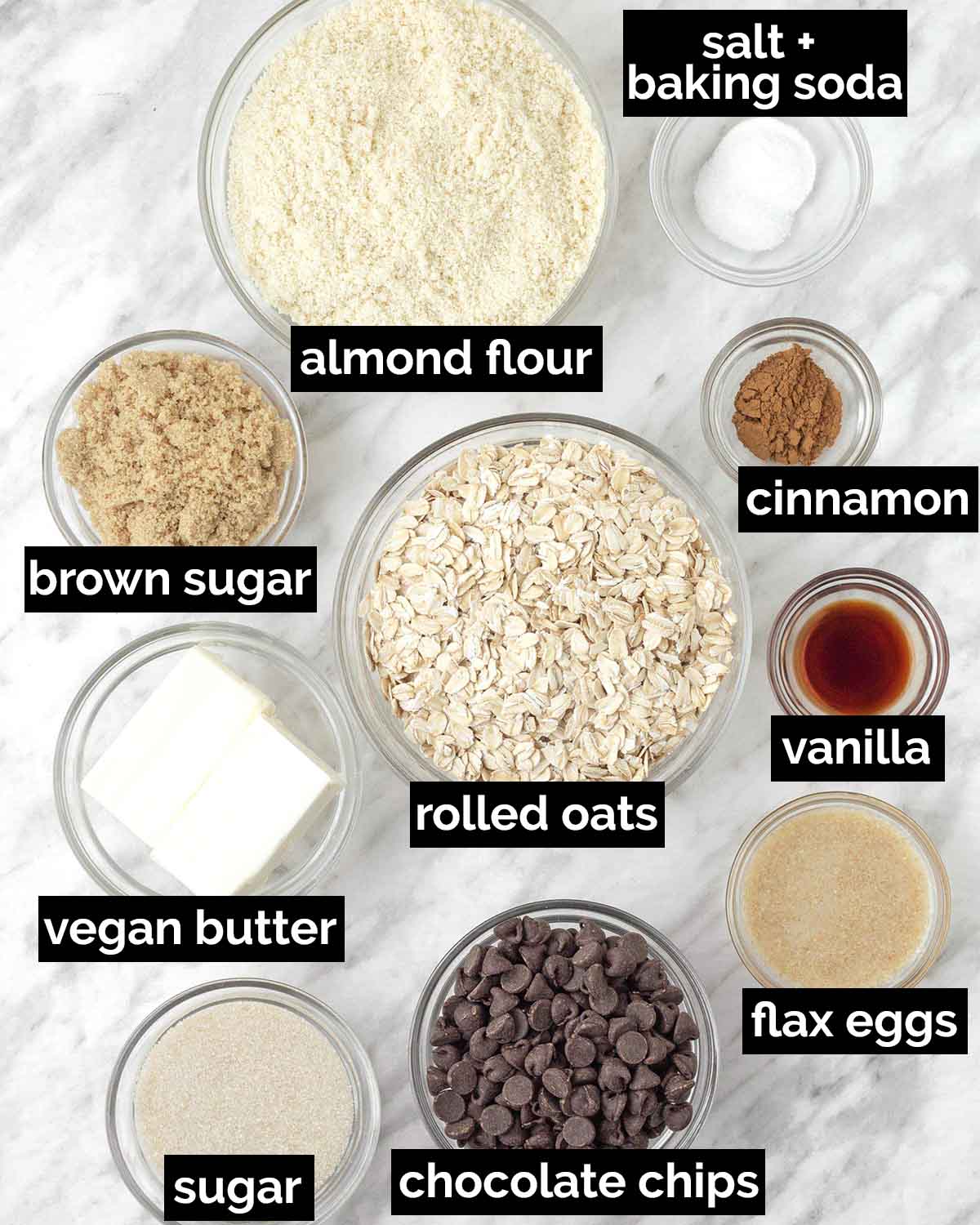 An overhead shot showing the ingredients needed to make vegan almond flour oatmeal cookies.