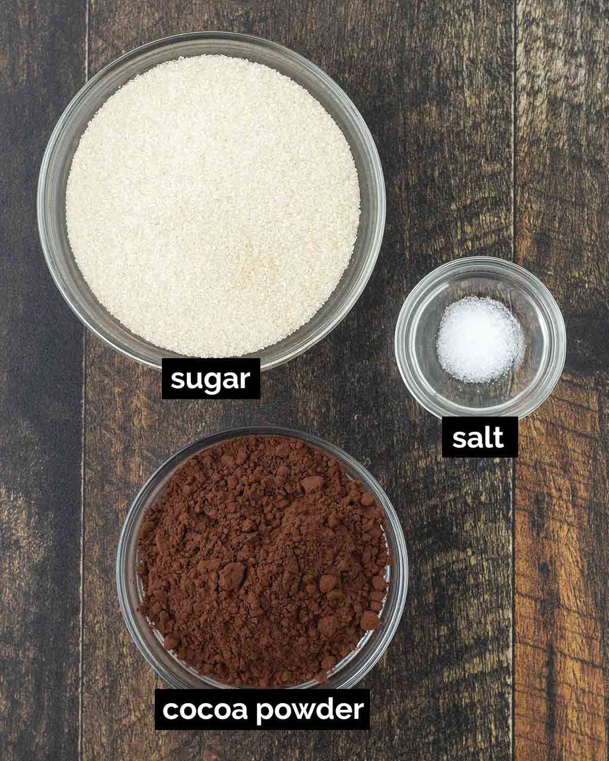 An overhead shot showing the ingredients needed to make a vegan hot cocoa mix.