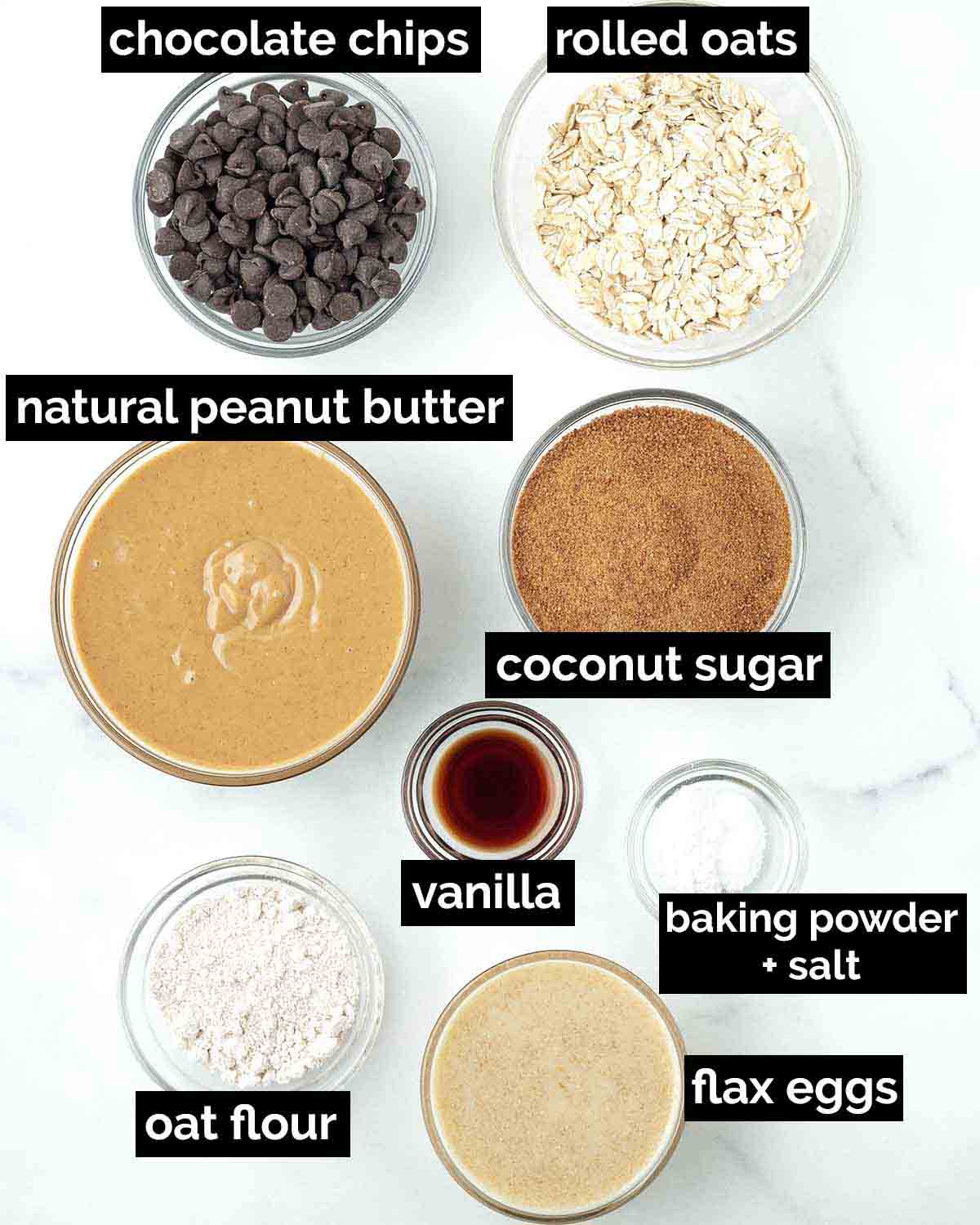 An overhead shot showing the ingredients needed to make vegan peanut butter oatmeal cookies.