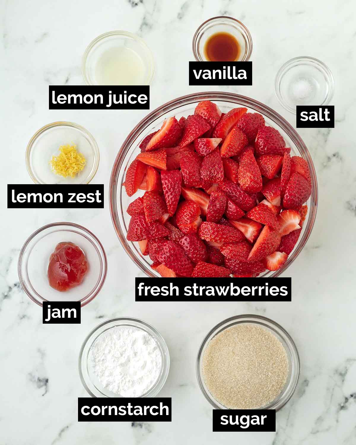An overhead shot showing the ingredients needed to make vegan strawberry pie.