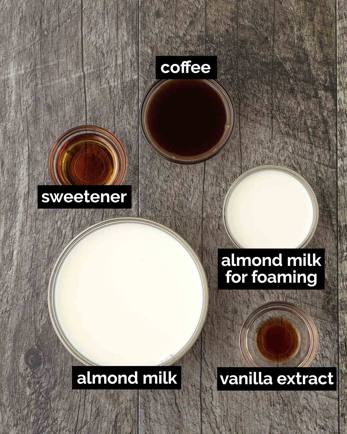 An overhead shot showing the ingredients needed to make an almond milk latte.