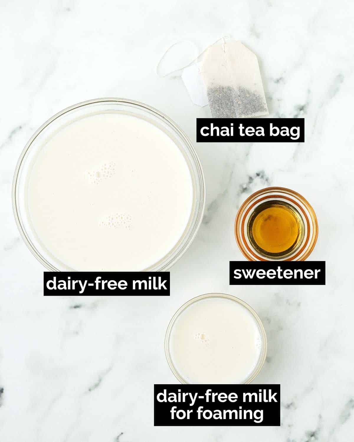 An overhead shot showing the ingredients needed to make a vegan chai latte.