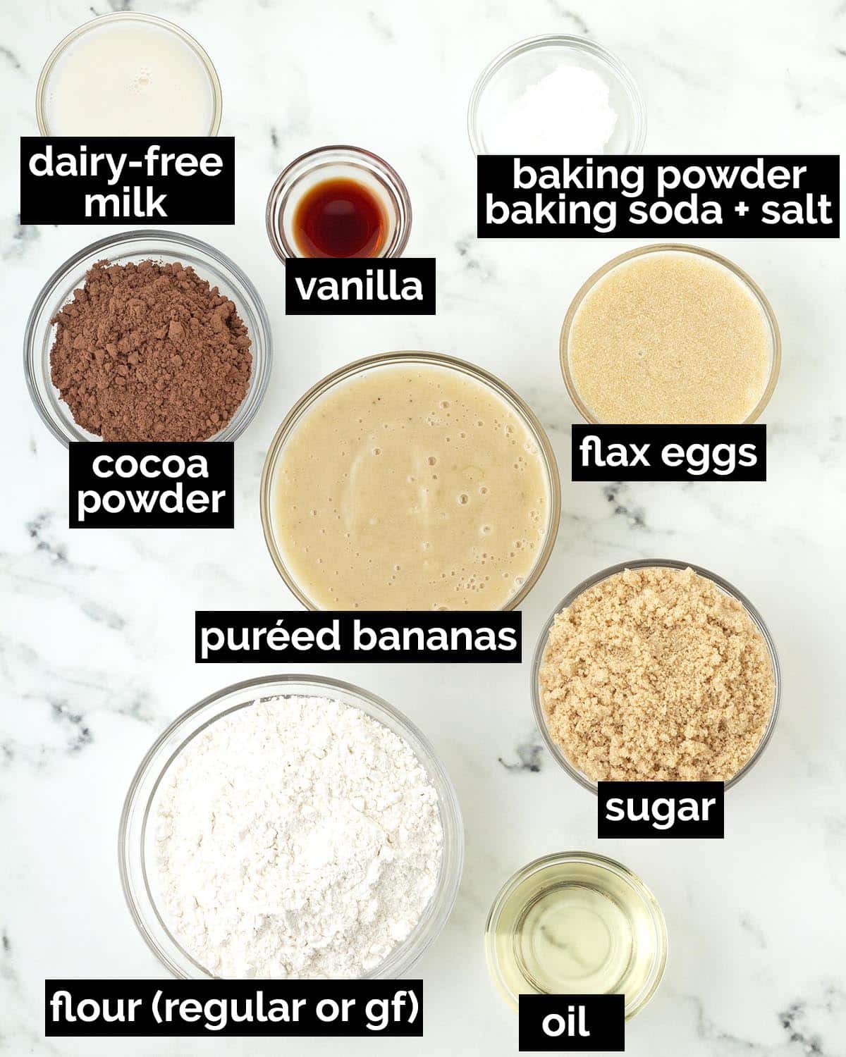 An overhead shot showing the ingredients needed to make vegan chocolate banana cake.